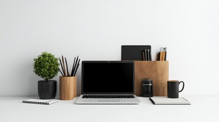 Modern workspace featuring a laptop, plant, stationery, and a minimalist aesthetic perfect for productivity.