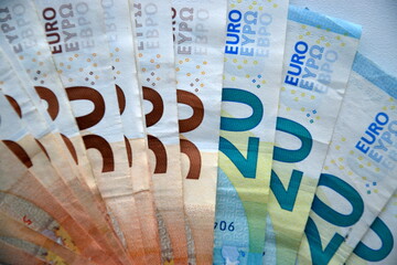 Many european euro money bills in chaotic arrangement. Pile of eur banknotes with different colors and condition