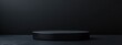© AImmersive Imagery - Contemporary black form on a dark backdrop Vacant platform for product presentation Box pedestal 3D rendered image