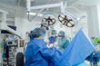© Vadim - Surgeons in action in a modern hospital operating room. A team of surgeons conducts a complex surgical procedure in a well-equipped hospital operating room