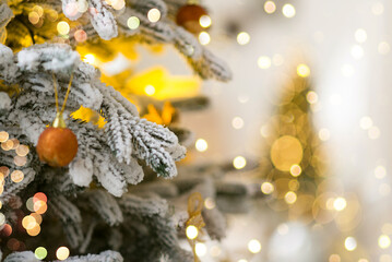 Wall Mural - christmas tree branches with decorations, balls, garlands, bokeh. postcard with space for text. merr
