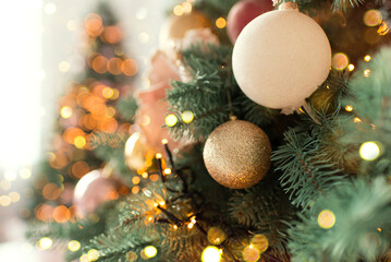 Wall Mural - Christmas tree branches with decorations, balls, garlands, bokeh. Postcard with space for text. Merry christmas card. Winter holiday theme. Happy New Year.