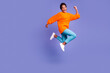 © Tetiana - Full length body size view of nice attractive lovely glad cheerful wavy-haired girl jumping having fun rising hands up isolated on bright vivid shine vibrant color background