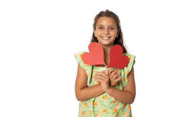 Smiling girl with two carton paper small little heart figures standing isolated over transparent background. Love concept.