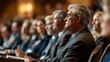 © anatoliycherkas - Audience members are engaged in a presentation by a speaker during a corporate event