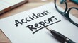 © vitanovski - Accident report form with pen and glasses in workplace setting