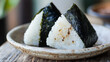 © bephoto - 焼きおにぎりと陶器の皿