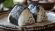 © bephoto - 焼きおにぎりと陶器の皿