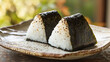 © bephoto - 焼きおにぎりと陶器の皿