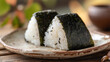 © bephoto - 焼きおにぎりと陶器の皿