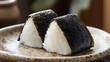 © bephoto - 焼きおにぎりと陶器の皿