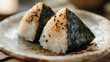 © bephoto - 焼きおにぎりと陶器の皿