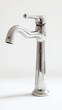 © AshrofS - Shiny metallic faucet with a sleek design, perfect for modern kitchens and bathrooms. A stylish and functional addition to any decor.