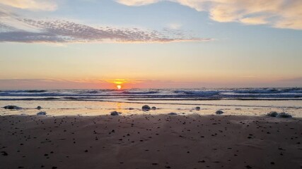 Wall Mural - Serene Beach Sunrise with Gentle Waves and Clouds - Perfect for Summer Vacation Promotions, Travel Posters, and Nature Wall Art