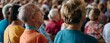 © gunzexx png and bg - A large crowd gathers in an indoor setting for an event, focusing on an elderly man sitting among the audience, emphasizing community, togetherness, and engagement.