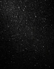 Wall Mural - nocturnal snowfall: textured white grain and dust against black