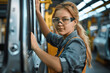 © btiger - Woman Working On Assembly Line In Factory Wearing Safety Goggles And Denim Shirt
