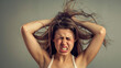 © Opium Creative - Frustrated Young Woman Pulling Her Hair Out in Rage. Anger Management, Emotional Outburst, and Stress Relief