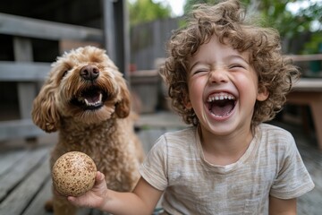 Wall Mural - A curly-haired kid is sitting with a playful dog, both enjoying a speckled ball. The image reflects a joyful interaction and fun companionship in a sunny outdoor setting.