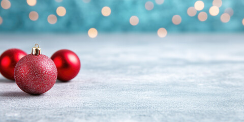 Wall Mural - red christmas baubles on snow background banner with xmas lights bokeh and copy space