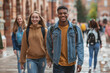 © PHAISITSAWAN - Photo full-length of happy college students walking together on campus.