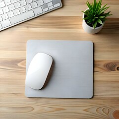 Wall Mural - A minimalist workspace with a gray mouse pad. a white computer mouse. a keyboard. and a potted plant.