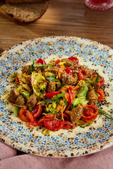 Canvas Print - Fresh Chicken Heart Salad with Vibrant Vegetables on Mosaic Plate