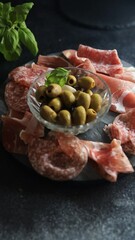 Wall Mural - meat plate and olives different types of meat salami, prosciutto, sausage, coppa natural food fresh appetizer meal food snack on the table copy space food background rustic top view