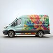 © Ehtisham - A sleek. light green van with a vibrant floral wrap.