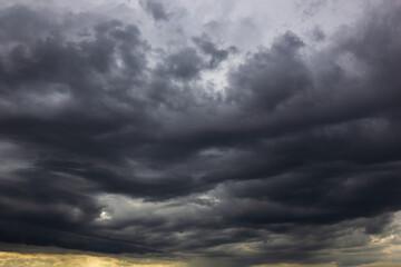 Aufkleber - The dark sky with heavy clouds converging and a violent storm before the rain.Bad or moody weather sky and environment. carbon dioxide emissions, greenhouse effect, global warming, climate change.