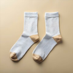 A pair of simple. yet stylish. grey socks with a subtle tan accent at the heel.