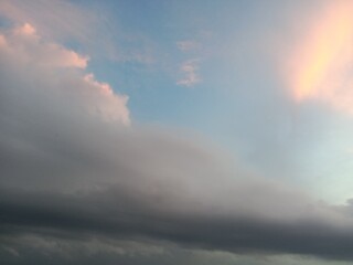 A clear blue sky with a few clouds. The sky is so clear that it almost looks like a painting