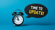 © Creative Habits - Alarm clock displaying time with update message on blue background