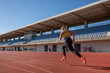 © Iryna Auhustsinovich/Stocksy - athletic girl training at the stadium