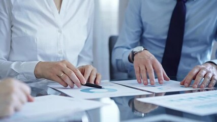 Wall Mural - Business people are reviewing a financial results and discussing the terms of the agreement. Audit and strategy