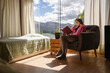 © Luis Herrera/Stocksy - woman reading a book at home