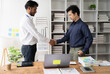 © Kritdanai - Professional Handshake: Two diverse businessmen shake hands in an office setting, symbolizing a successful partnership or deal. The image showcases trust, collaboration, and mutual respect.