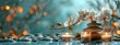 © Yuliia - Beautiful zen stones pyramid with cherry blossom on turquoise background with golden bokeh lights, spa and wellness panoramic scene for meditation.