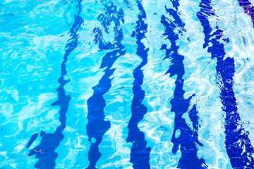 excitement on blue water in pool and blue stripes on the bottom