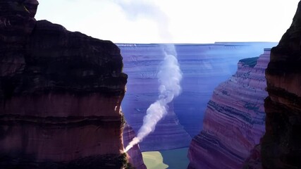Poster - Smoke rises from canyon surrounded by cliffs in a fantastical world, sun shining on rugged landscape, creating peaceful atmosphere