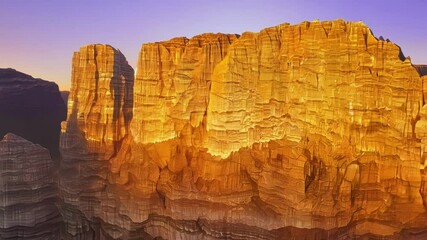 Poster - Majestic mountain range glows in golden light at sunset, creating a dreamlike landscape with vibrant hues and dramatic cliffs against a colorful sky