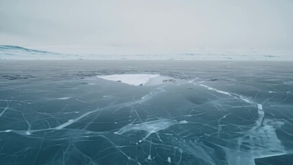 Poster - Showing a frozen lake surface covered with snow and ice cracks on a cloudy day, this image evokes feelings of coldness and solitude