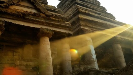 Poster - Sunlight bathes ancient temple ruins, creating a mystical atmosphere. Golden beams add drama and serenity, making it a peaceful travel destination in cambodia