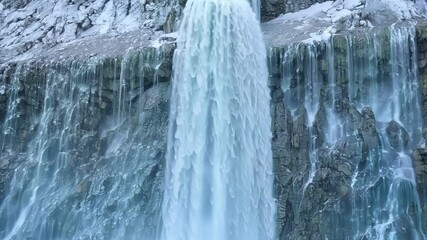 Aufkleber - Turquoise water flows down rugged mountain creating tranquil, powerful scene. Cascading waterfall blends nature and fantasy seamlessly, exuding magic and wonder