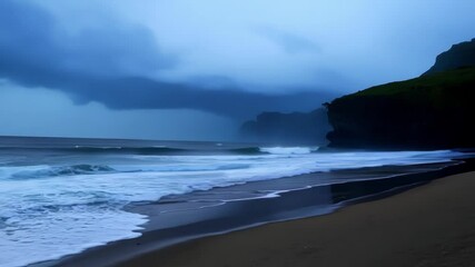 Canvas Print - Blue waves crash onto sandy beach as storm looms in distance, dark clouds fill sky creating moody atmosphere. Nature's power on display, wild weather adds awe to seascape