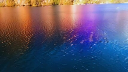 Aufkleber - The blue water reflects a fantasy sky with rainbow colors, creating a magical and ethereal atmosphere. The vibrant scene is dreamlike and tranquil, evoking peace