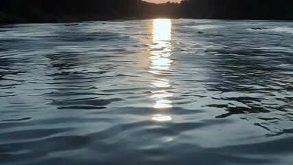 Aufkleber - The golden sunset reflects on calm water, creating a magical atmosphere like a dream