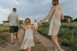© Anna Artemenko/Stocksy - Family on a walk outside the city