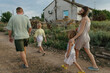 © Anna Artemenko/Stocksy - Family on a walk outside the city