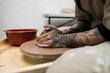 © Felipe Barrera/Stocksy - ceramist making pot on clay wheel